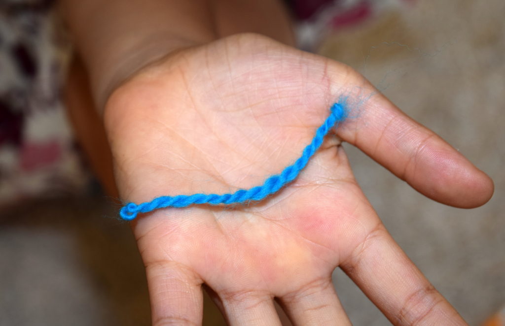 Kids can thigh spin a tiny piece of wool yarn! Little House on the Prairie Party Ideas and Activities - MakeHardware.com